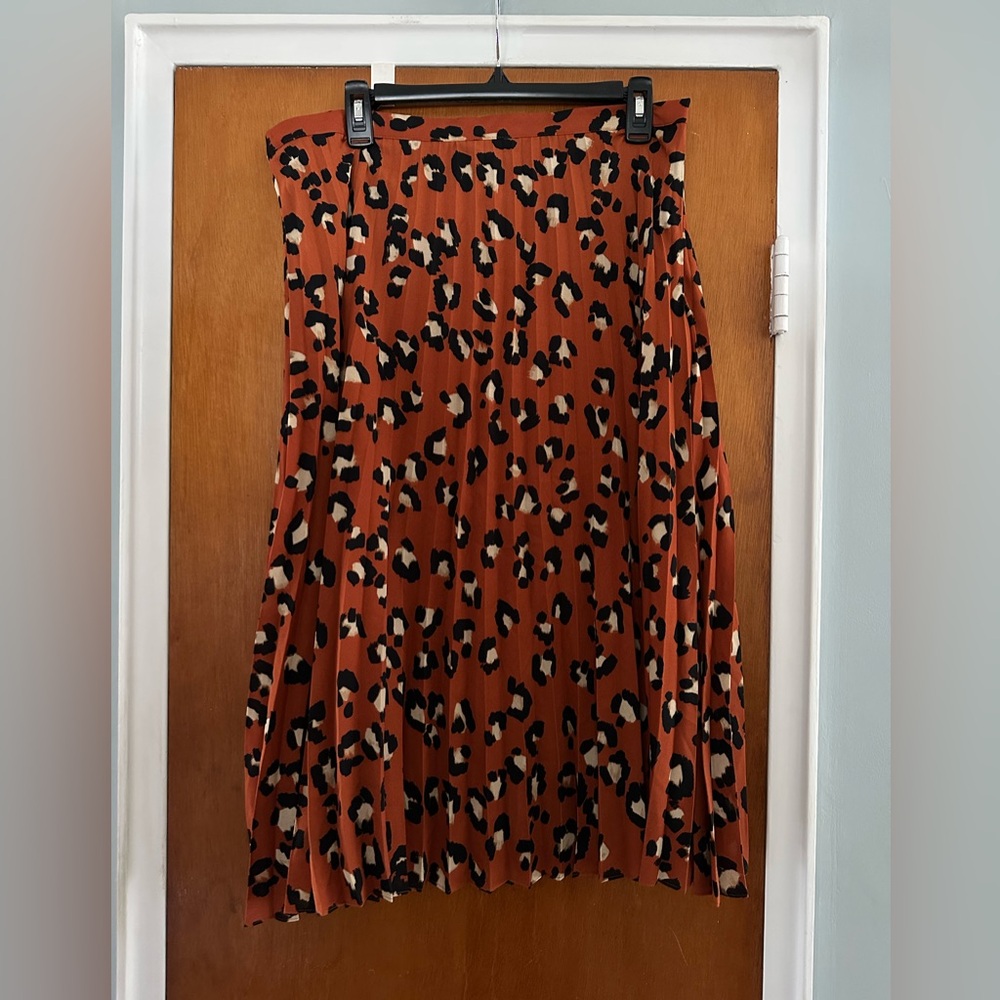 Burnt orange animal print pleated skirt, size 14.